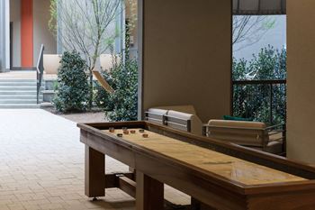 Game Room With Shuffle Board at Civic at Frisco Square Apartments, Texas
